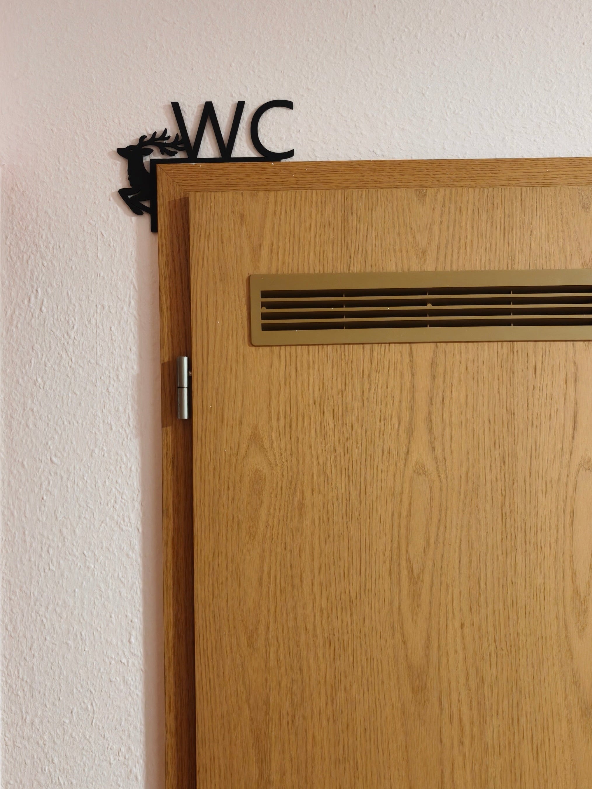WC‑Schild mit Hirschmotiv